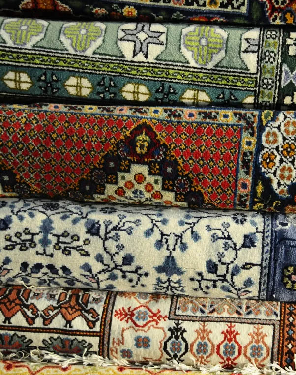 A close up of several different types of rugs.